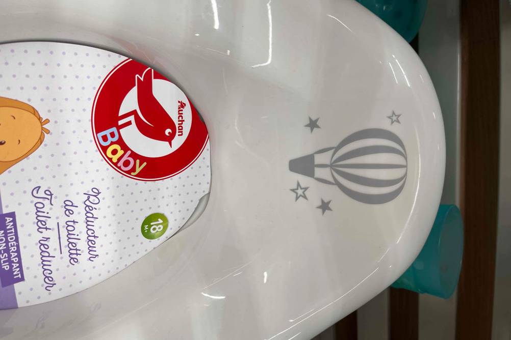 Toilettensitz-Kinder getestet: oberer Teil von Toilettensitz mit Heißluftballon als Motiv darauf.