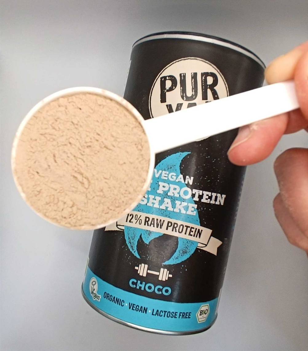 Proteinpulver in Messlöffel.