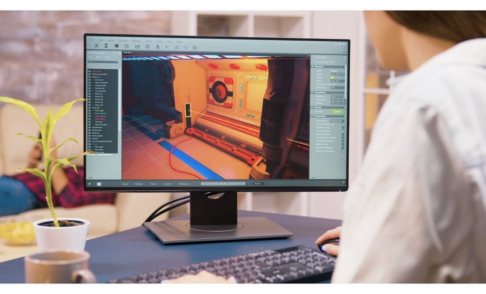 Ein junger Mann fertig eine CAD-Zeichnung auf einem getesteten ViewSonic-Monitor an.