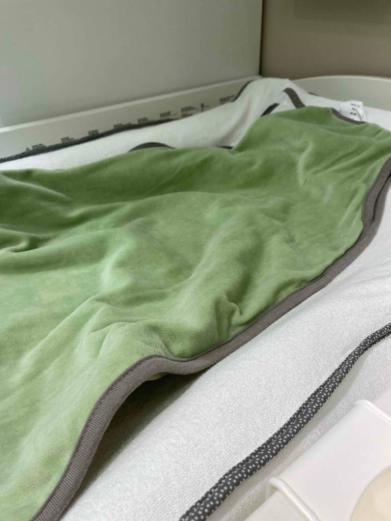 Babyschlafsack ausgebreitet.