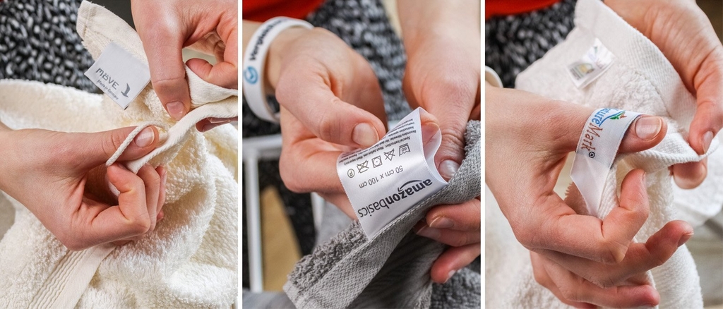Verschiedene Wasch- und Materialzettel an Handtüchern