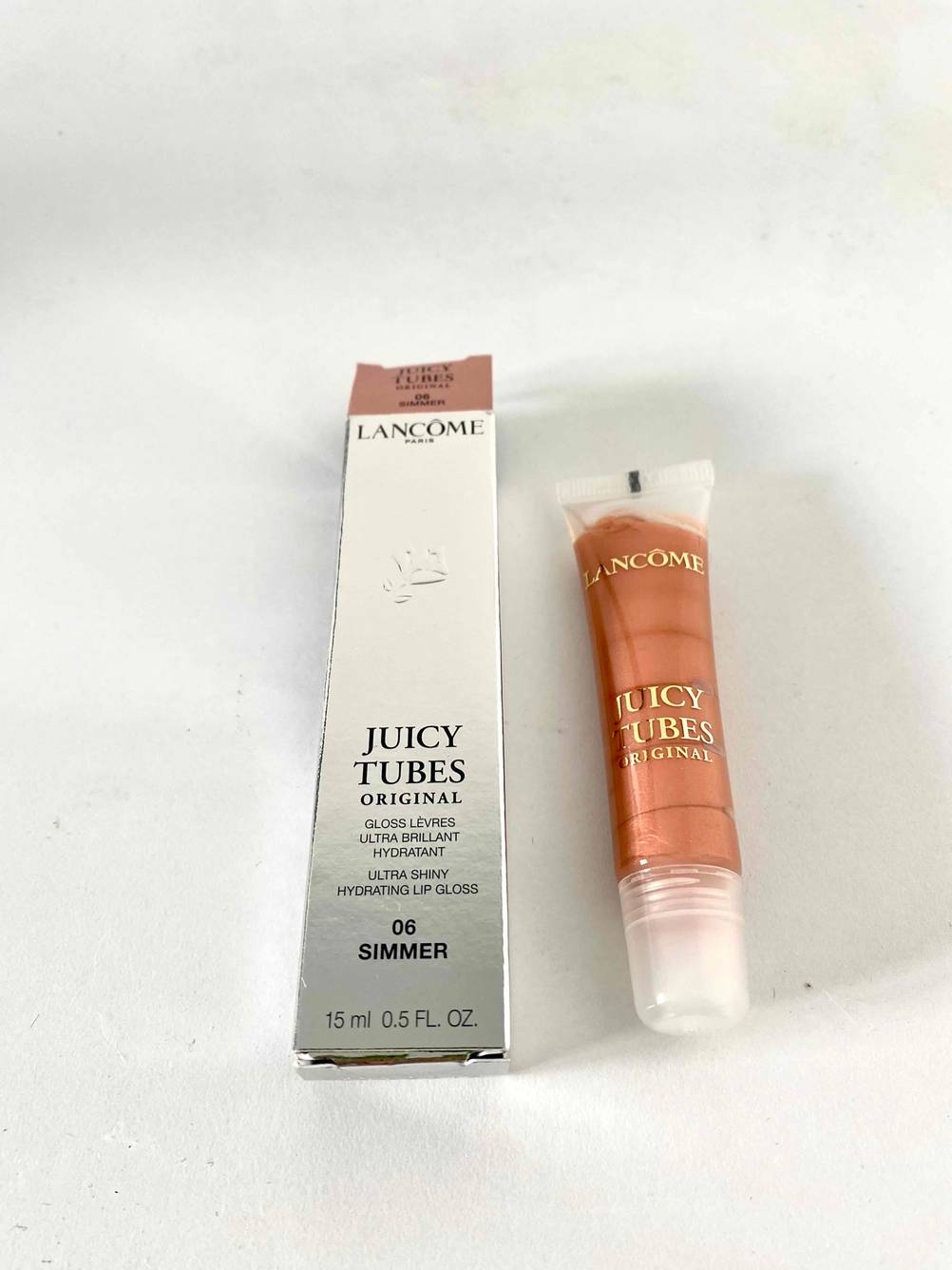 Lancôme Lipgloss und Verpackung zu sehen.