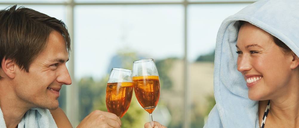 Italy, SouthTyrol, Couple enjoying drink in hotel urthaler