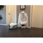 Ein Korb mit Wäsche steht neben der ProfiCare PC-HBB 3117