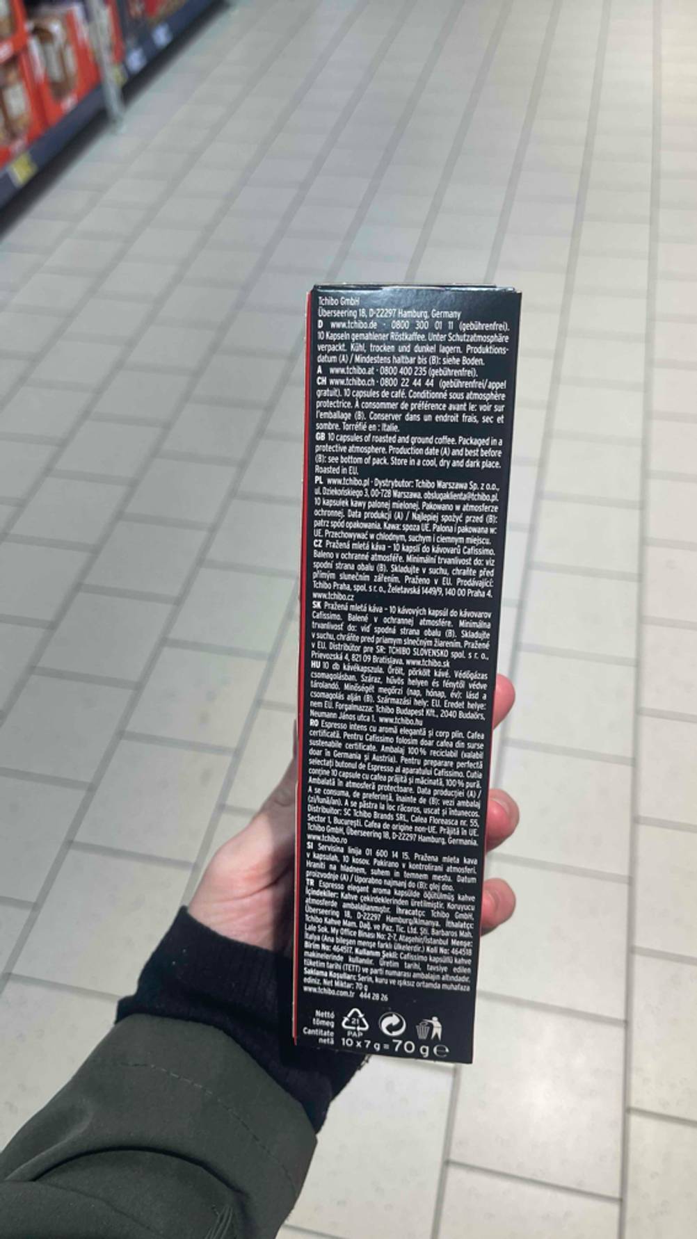 Ansicht der Produktbeschreibung auf der schwarzen 70-g-Packung mit den Cafissimo-Kapseln im Test.