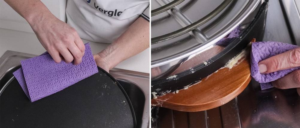 Eine Frau reinigt einen Crepes-Maker mit einem Tuch