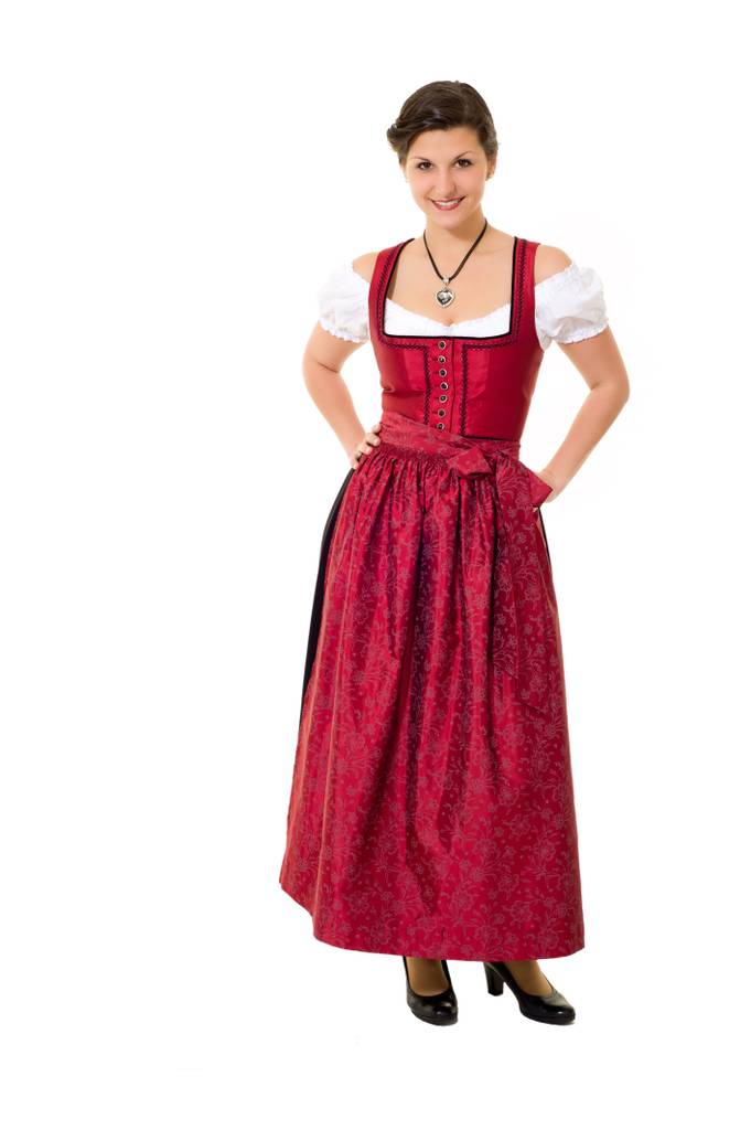 Dirndl-Damen-Test: Frau trägt ein Dirndl mit weißer Bluse und roter Schürze.