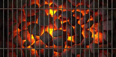 Elektrischer Grillanzünder getestet: Glühende Kohlen unter einem Gitter.