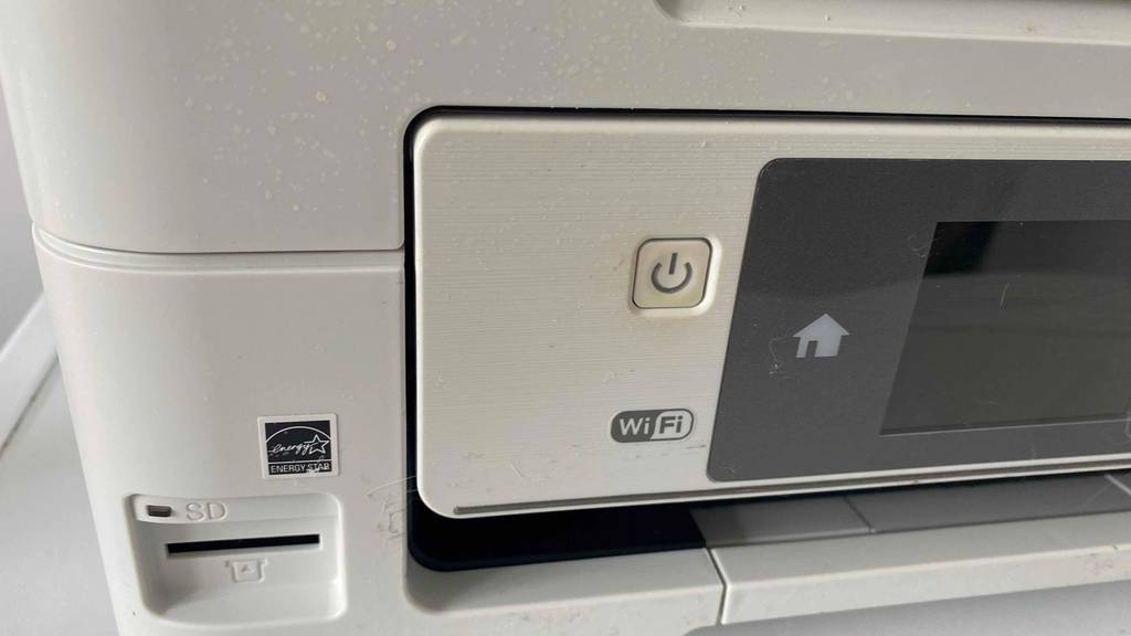 Auf einem getesteten Epson Drucker ist das WiFi-Symbol aufgebracht.