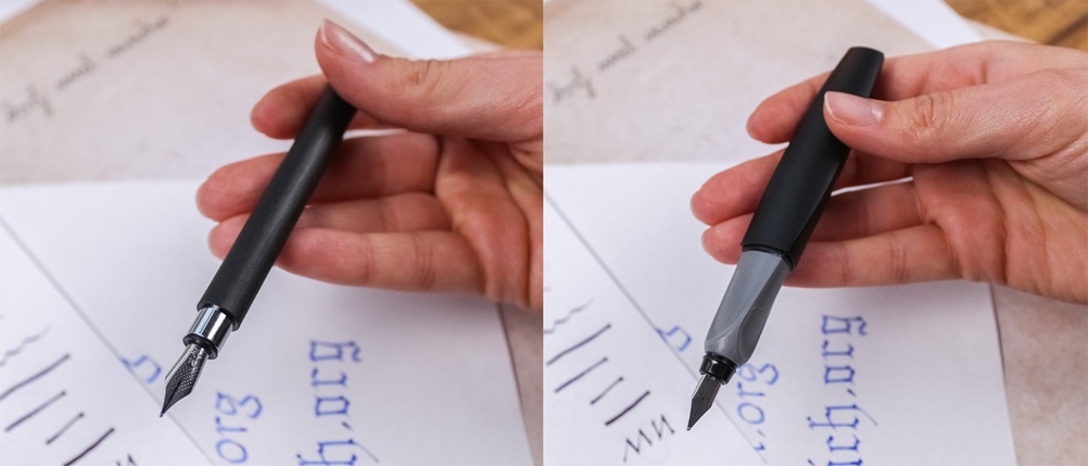 Zwei Füller von Faber Castell und Pelikan werden in der Hand gehalten.