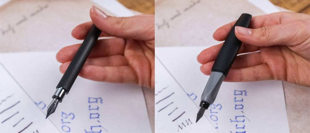 Zwei Füller von Faber Castell und Pelikan werden in der Hand gehalten.