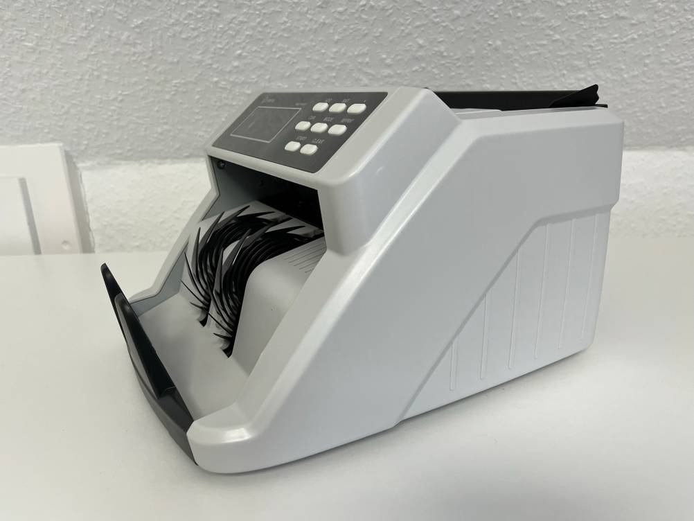 Geldzählmaschine im Detail mit Rollen