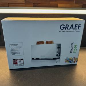 Der Karton des Graef TO91 steht auf einer Küchenarbeitsplatte.