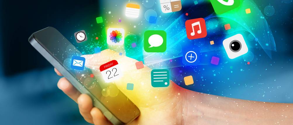 Hand holding smartphone with colorful app icons concept