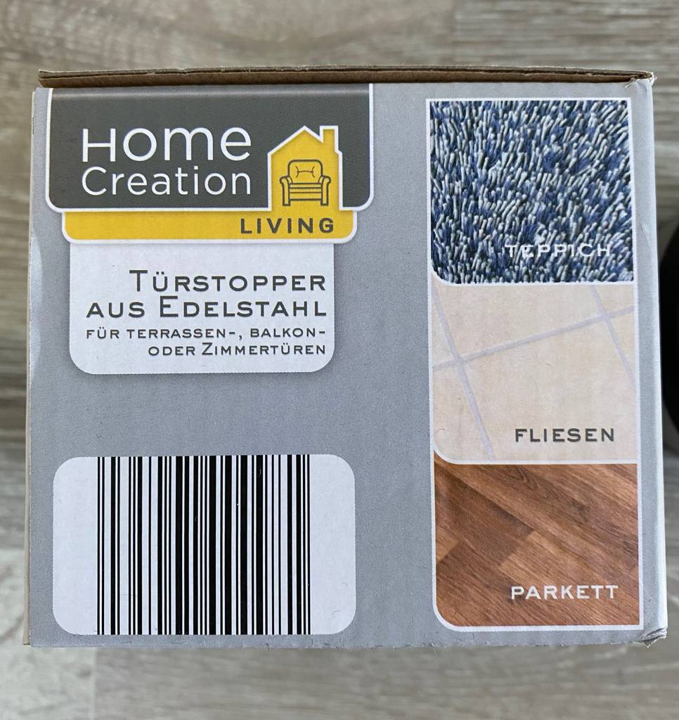 Verpackung eines getesteten Türstoppers mit Produktinformationen.
