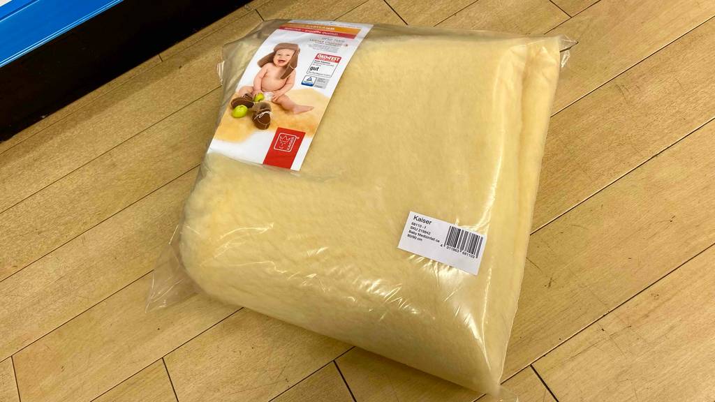Lammfell-Baby-Test: Lammfell.Baby in Verpackung.