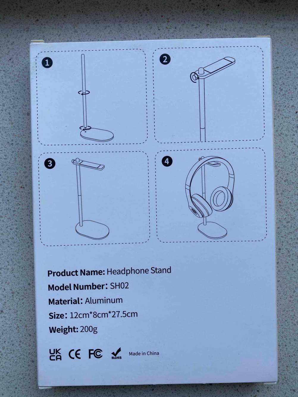 Kopfhörerständer getestet: Rückseite der Originalverpackung mit Infografiken.
