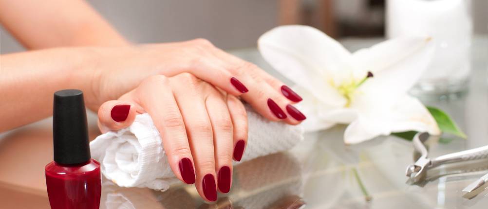 Manicure concept. Hand care at the spa. Beautiful woman's hands with perfect manicure at beauty salon.