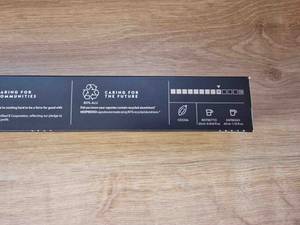 Nahaufnahme der Stärkeangaben auf der Rückseite einer Packung Nespresso-Kapseln.