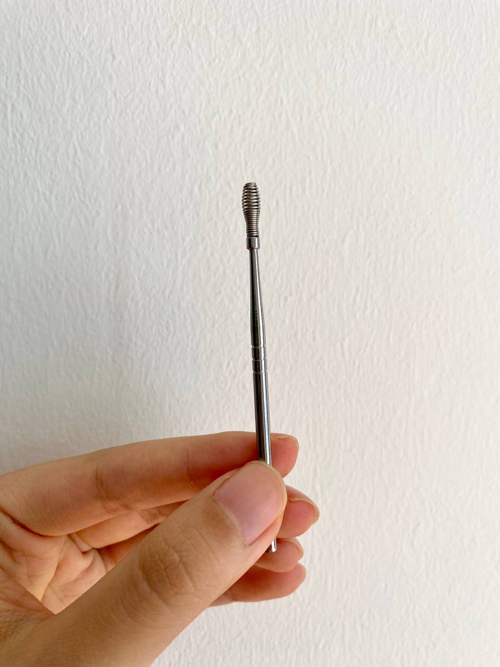Ohrenreiniger einzelnd mit Metallbürste.