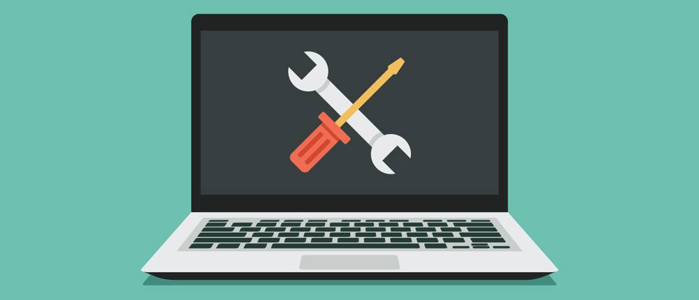 PC-Tuning-Software-Test: Grafische Darstellung eines Laptops vor einem grünen Hintergrund mit einem Schraubenzieher- und Schraubenschlüssel-Symbol auf dem Display.