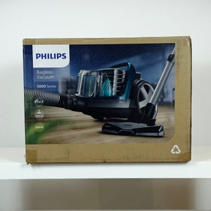 Die Vorderseite der Verpackung des Philips FC9555/09 Staubsaugers zeigt das Gerät in voller Ansicht. Der Markenname und die Serie sind gut lesbar.
