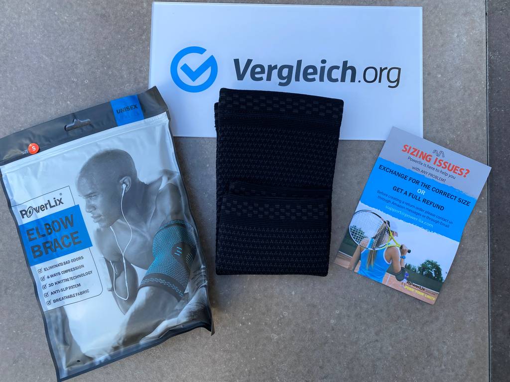 Ellenbogenbandagen ausgepackt mit Verpackung zu sehen.