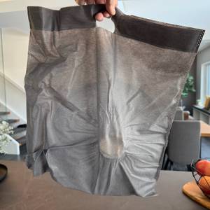 Deckel der Redchef-Pfanne in einem Stoffbeutel