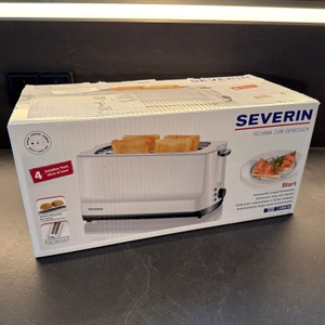 Der Karton vom Severin AT 2234 steht auf einer Küchenarbeitsplatte