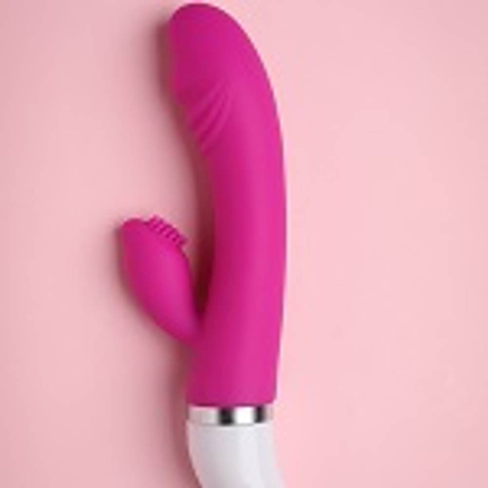 Sexspielzeug getestet: Pinker Vibrator auf rosa Untergrund
