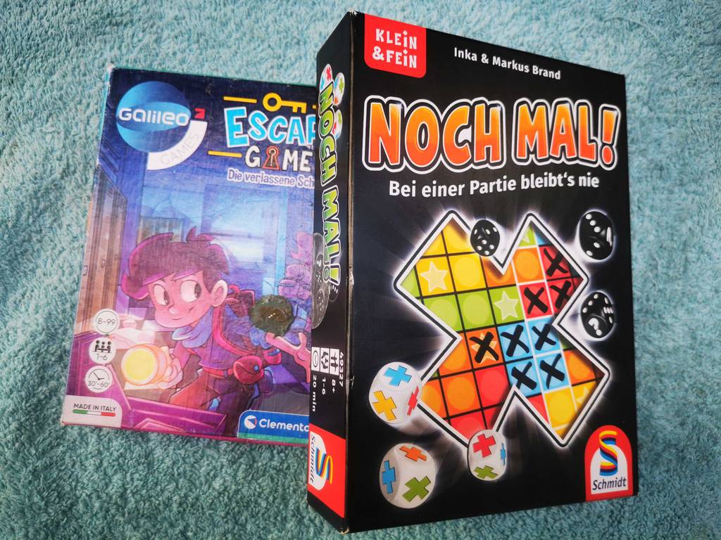 Spiele ab 8 Jahren im Test: Zwei verschiedene Spiele liegen halb übereinander.