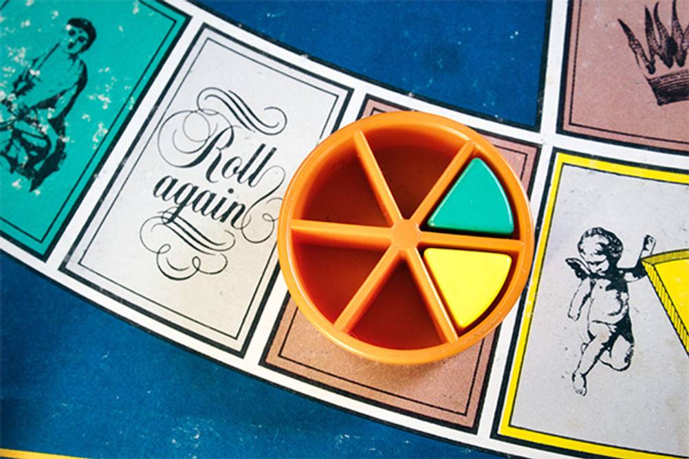 Trivial Pursuit im Test: Ein Spielbrett mit einem orangenen Spielstein darauf.