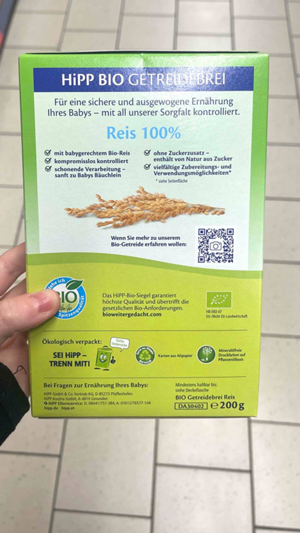 Getesteter Getreidebrei: Ansicht der Produktbeschreibung auf einer grünen 200-g-Packung Reisbrei von Hipp.